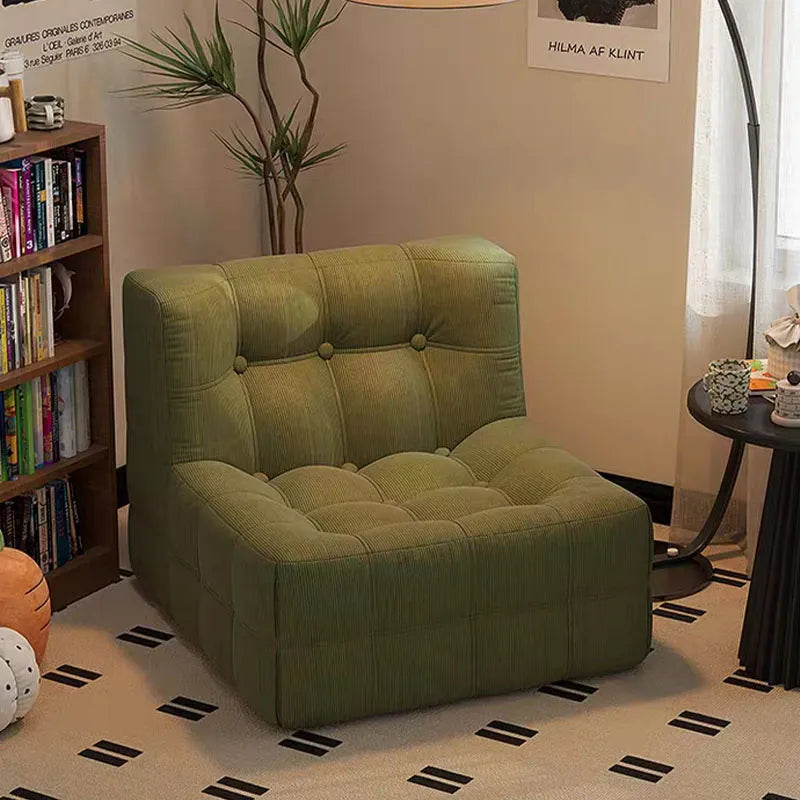 Fauteuil bas marron foncé capitonné – design contemporain sans accoudoirs