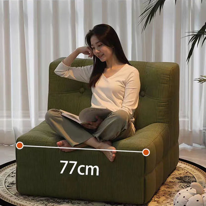 Fauteuil bas marron foncé capitonné – design contemporain sans accoudoirs