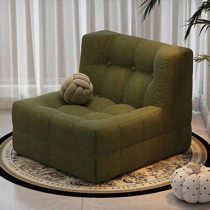 Fauteuil bas marron foncé capitonné – design contemporain sans accoudoirs