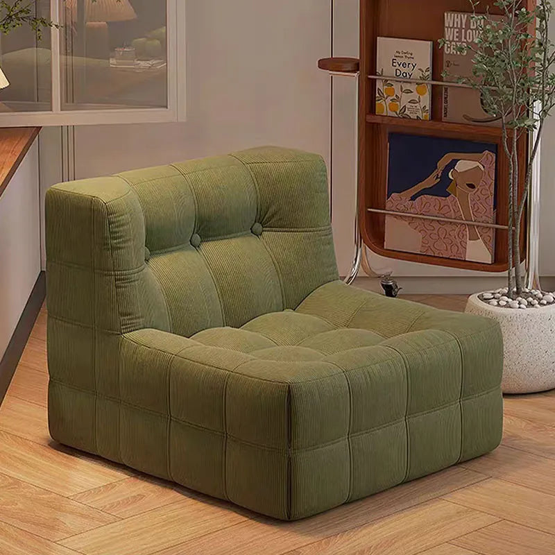 Fauteuil bas marron foncé capitonné – design contemporain sans accoudoirs